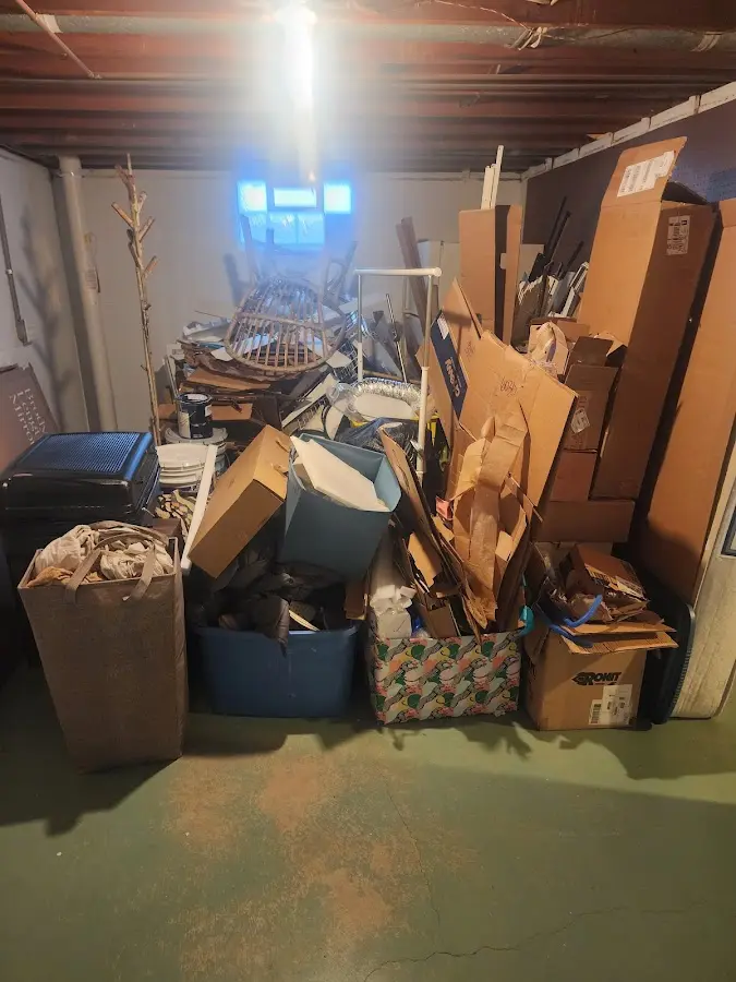 Roll-off dumpster container at job site for 2 Yard Dumpster Rental in Deale